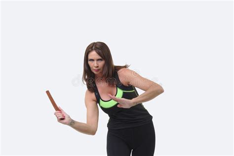 Attractive Middle Aged Woman In Sports Gear Wielding A Tanto Or Wooden
