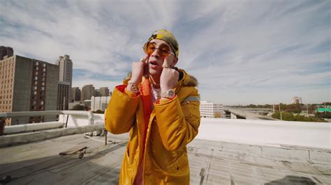 Bad bunny wallpapers is an application that provides images for bad bunny fans. Bad Bunny Aesthetic On Top Of Building Wearing Yellow ...