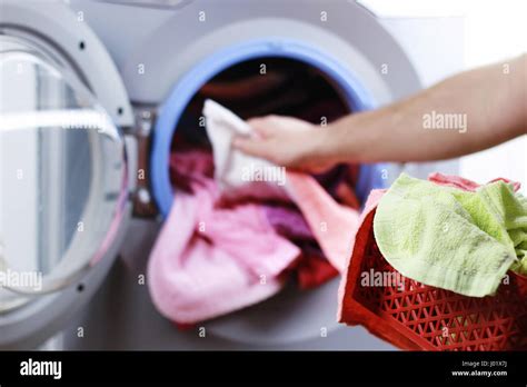 Put Cloth In Washer Stock Photo Alamy