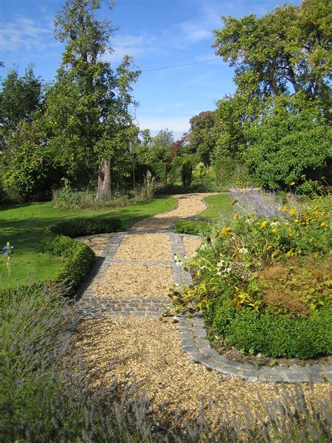 Granite Setts Edge This Gravel Country Garden Path From A Front Garden