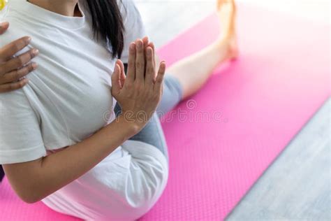 Asian Women In Yoga Poses Close Up In Her Hands In Yoga Studio With