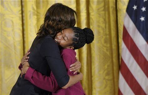 Isoke Receives A Hug From The First Ladymichelle Obama First Lady