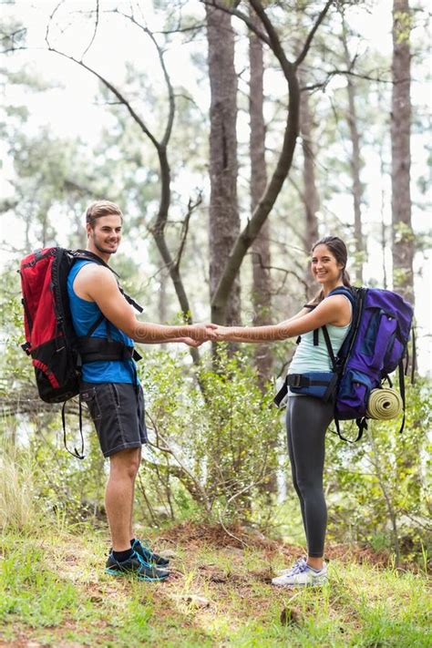 Happy Hikers Holding Hands Looking At Camera Stock Image Image Of