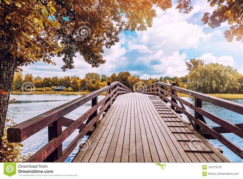 Beautiful Bright Colorful Autumn Landscape A Wooden Bridge Across The