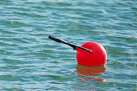 Premium Photo Red Buoy Floating In The Water