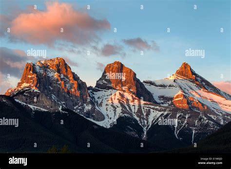 The Three Sisters Mountain Peaks At Sunrise Canmore Alberta Canada