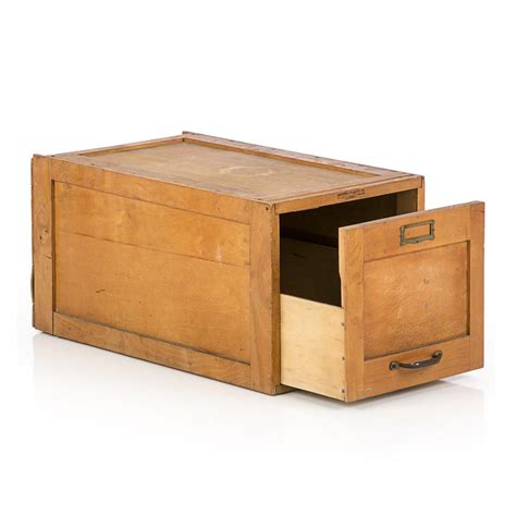 It has a beautiful dark wood. Wood Single Drawer Filing Cabinet - Modernica Props