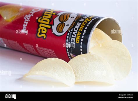 Open Tub Of Pringles Original With Contents Spilled On White Background