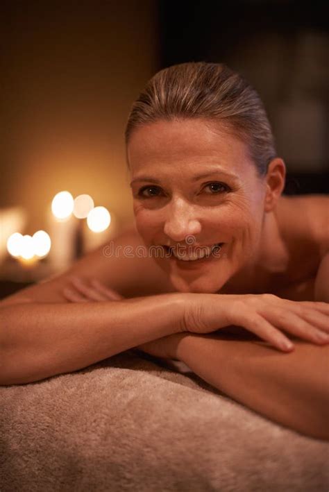 shes leaving her troubles behind today a woman in a day spa relaxing on a massage table stock