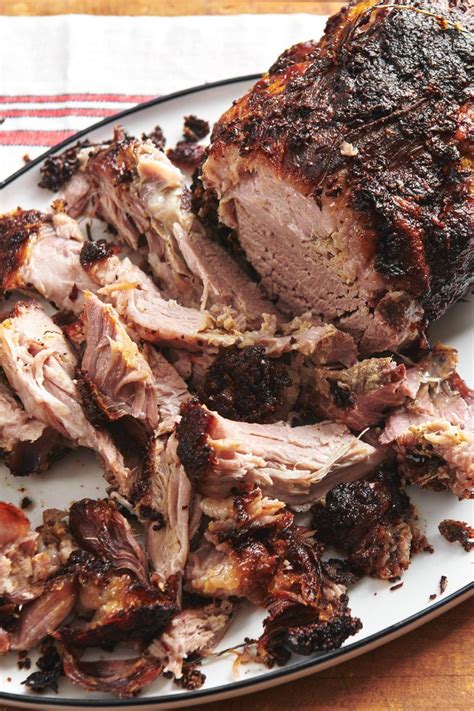 Though there's not a lot of fat, it loses it toughness with the long cook time. Easy Fall-Apart Roasted Pork Shoulder Recipe — The Mom 100 in 2020 | Pork shoulder recipes, Pork ...