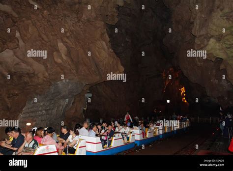 Tourists On Underground Roller Coaster In Crown Cave Guilin China