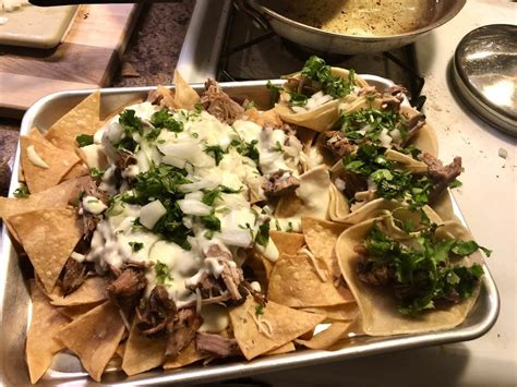 Homemade Carnitas Nachos With Some Carnitas Tacos On The Side Food