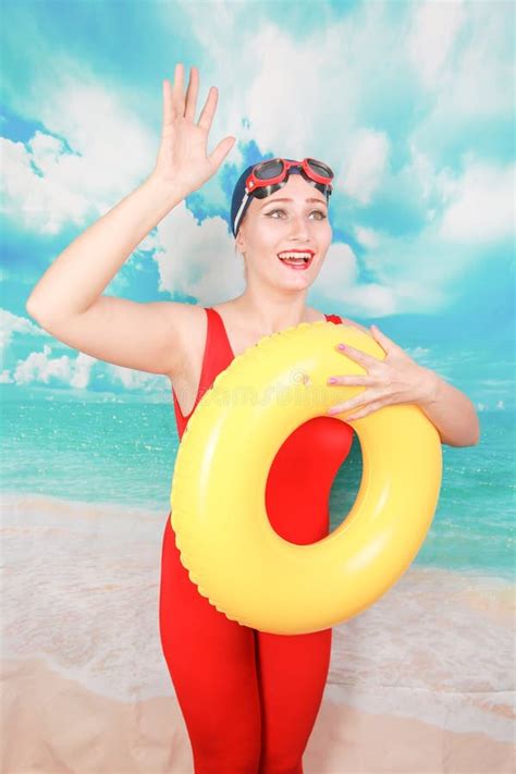 Studio Shot Of Beauty Women Wear Red Vintage Swimsuit And Carrying Life