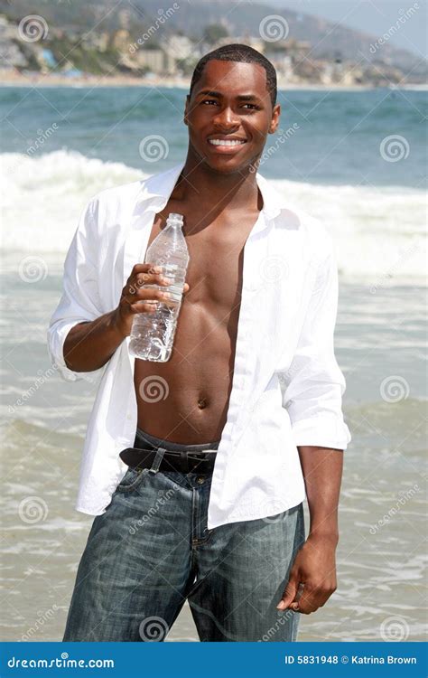 Happy African American Man Drinking Water On The Stock Photo Image Of