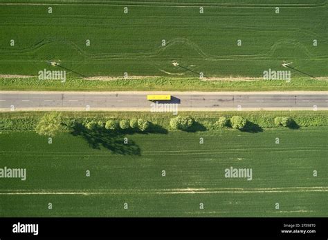Yellow Truck On Country Road Stock Photo Alamy