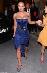 mel b struggles to contain her ample cleavage in strapless dress as she makes eye popping