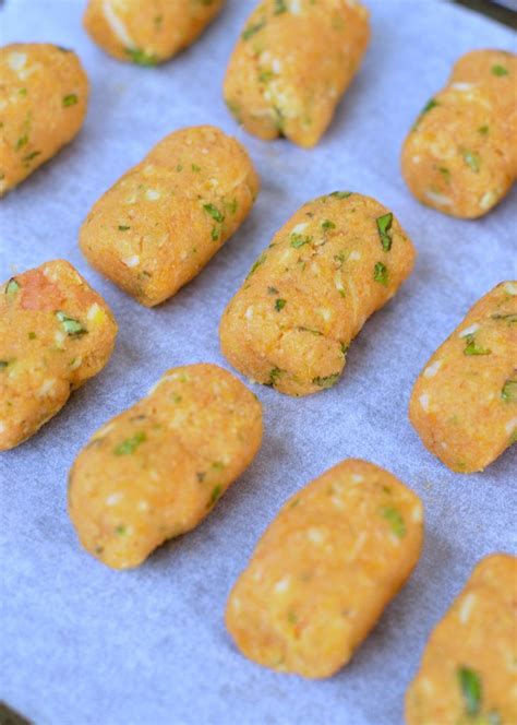 My dogs go crazy for these simple sweet potato treats. Baked sweet potato tots using mashed sweet potato. A great ...