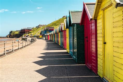 Premium Photo Colorful Beach Huts At Sumertime In Whitby England Uk