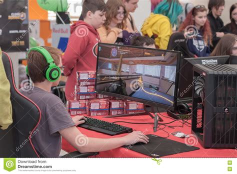 Young Boy Play Game On Personal Computer At Animefest