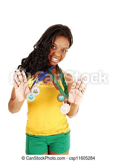 With Her Medals Pretty Black Woman Standing For White Background In A Yellow Top And Green