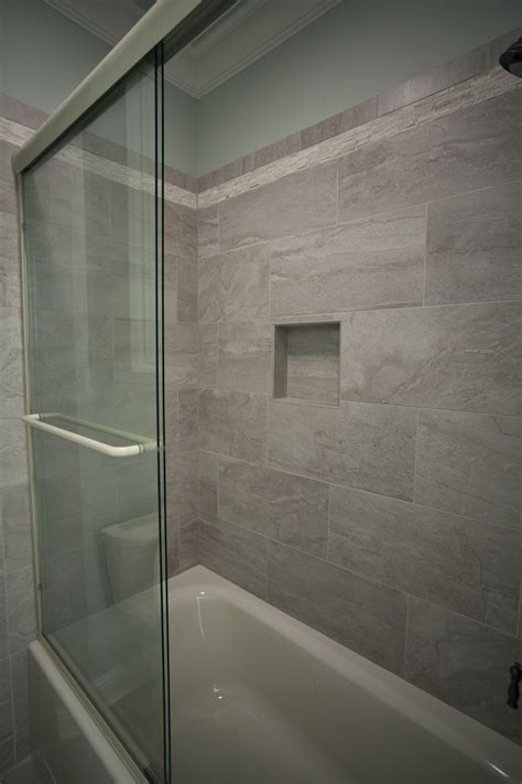 As projects go, tiling a small bath isn't exactly a quick and easy task, but if you are patient and diligent it can be a very rewarding experience. custom shower with 12 x 24 tiles | Bathroom shower walls ...