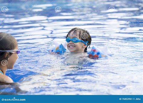Happy Girl And Boy Enjoying In Swimming Pool Stock Image Image Of