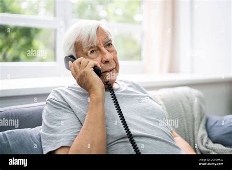 Senior Old Man Talking On Landline Telephone Stock Photo Alamy