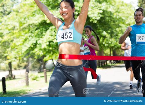 Marathon Runner Crossing Finish Line Stock Image Image Of Runners