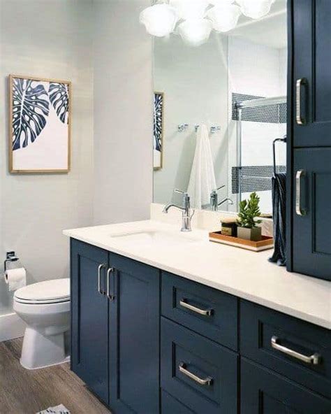 The large size mirror looks beautiful in the blue wall. Top 50 Best Blue Bathroom Ideas - Navy Themed Interior Designs