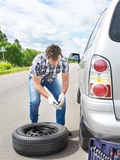 Man Changing A Spare Tire Of Car Stock Photo Image Of Auto Transport
