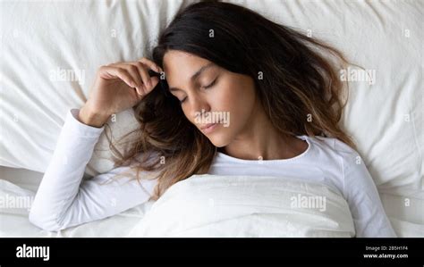 Calm Young Woman Relax Sleeping In Cozy Bed Stock Photo Alamy