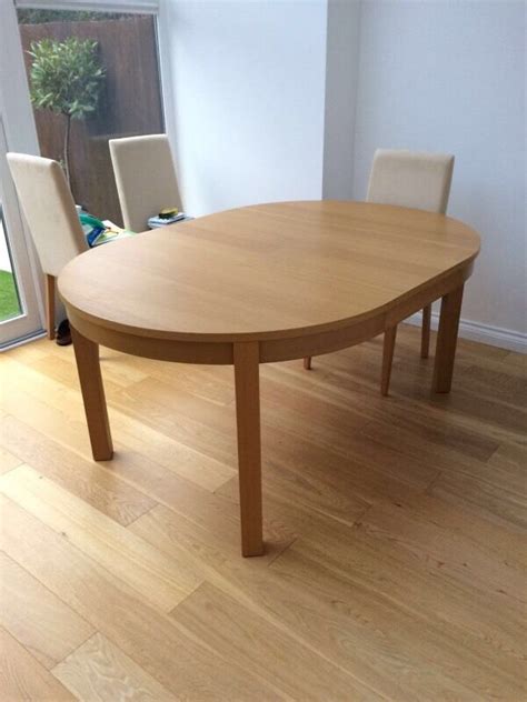 Round dining table for 4. Ikea Bjursta oak extendable dining table (round/oval) £40 ...