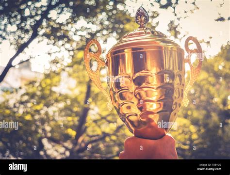 Holding Gold Trophy Stock Photo Alamy
