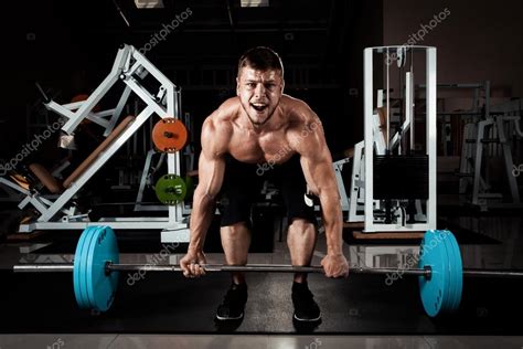 Muscular Men Lifting Deadlift — Stock Photo © Takoburito 74394873