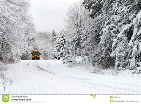 School Bus Drives On Snow Covered Rural Road Stock Photo Image Of