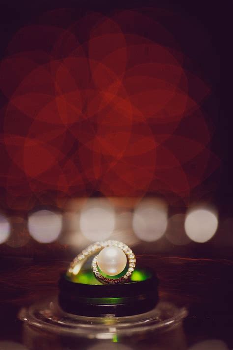 A Wedding Ring Sitting On Top Of A Table