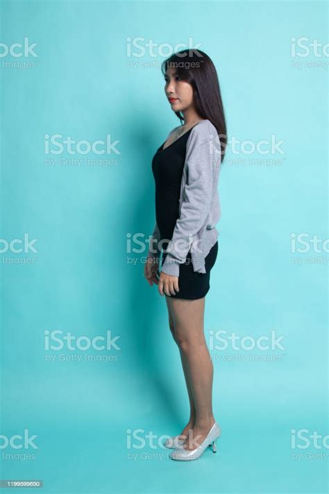 Full Body Side View Of Beautiful Young Asian Woman Stock Photo