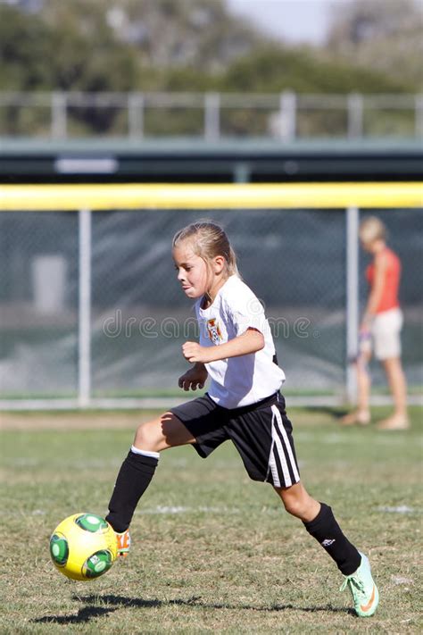 Girls Youth Soccer Football Player Kicking The Ball Editorial Stock