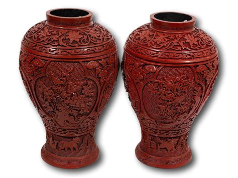 Lot A Pair Of Chinese Carved Red Lacquer Vases 28cm