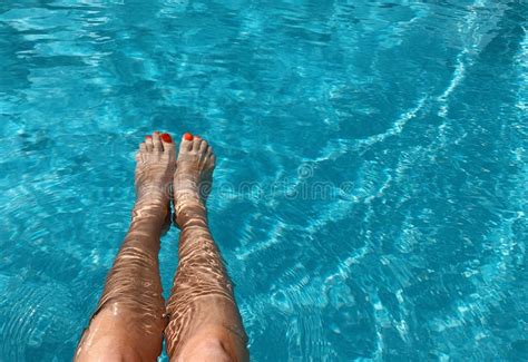 Feet In The Swimming Pool Relax Vacation Summer Red Nails Suntanned Skin Turquoise Water