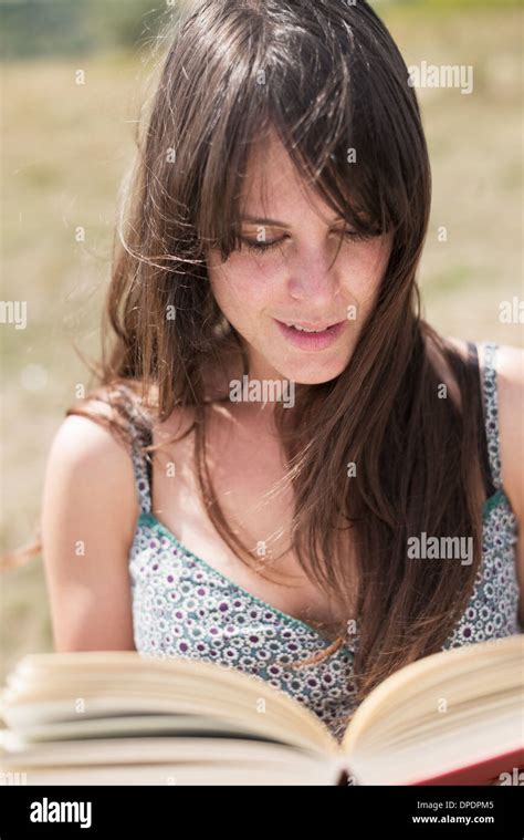 Mid Adult Woman Reading Book Stock Photo Alamy