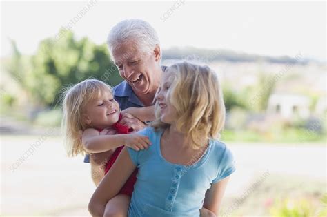 grandfather playing with granddaughters stock image f004 3342 science photo library