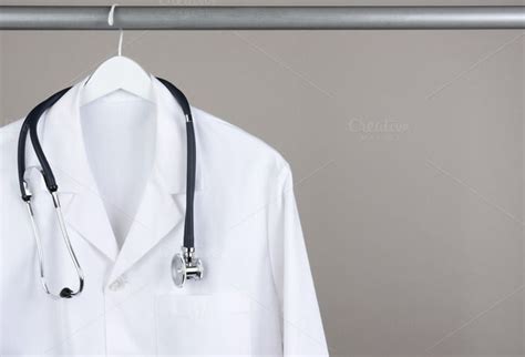 Lab Coat With Stethoscope On Hanger Doctor Medical Naturopathic