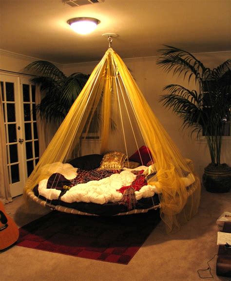 Redefine the way you relax in the great outdoors by snuggling up inside the hanging canopy hammock. Suspended In Style - 40 Rooms That Showcase Hanging Beds