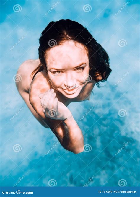 Portrait Of Naked Woman Underwater In Tropical Ocean Stock Photo