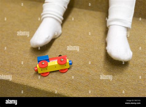 Berlin Germany A Childs Legs And Toys In A Nursery Stock Photo Alamy