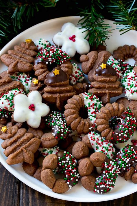 I'm always looking for new holiday cookies to bake, so i put together this ultimate list of christmas cookies, with more than 100 recipes! Chocolate Spritz Cookies - Dinner at the Zoo