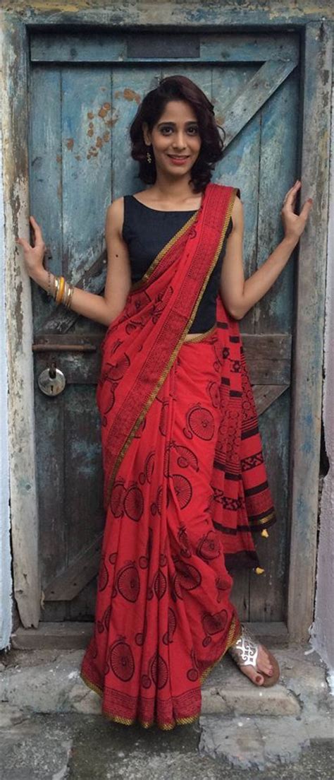 Festival hairstyles, hairdo diy, indian hairstyle, long hair hairstyles, saree hairstyle, sari hairstyle. Red saree with cycle print paired with plain black blouse ...
