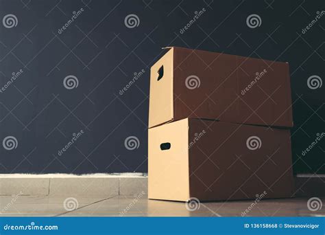 Packing And Moving Home Cardboard Boxes On The Floor Stock Photo