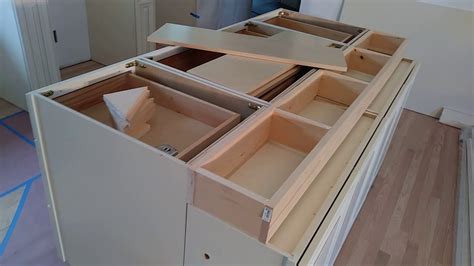 · making your own custom kitchen cabinets doesn't have to be difficult. How to build and make a double sided kitchen island from wall cabinets | Diy Kitchen island ...